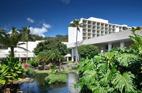 Arrive to a lush tropical resort surrounded by gardens.