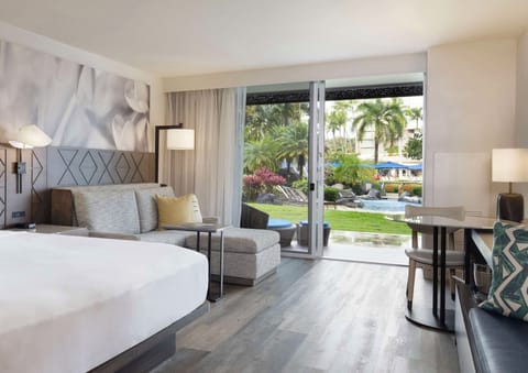 Lounge in your suite with garden views and open air.