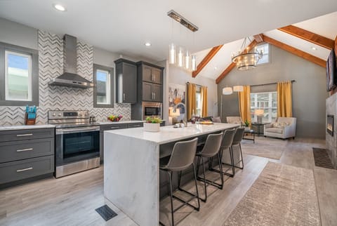 Modern kitchen with sleek countertops, stainless steel appliances, and a spacious island—ready for meals and memories!