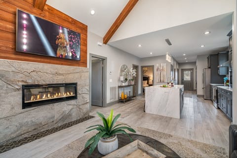 Bright and inviting living room with cozy seating, vaulted ceilings, and stylish décor—perfect for relaxing after a day of exploring!