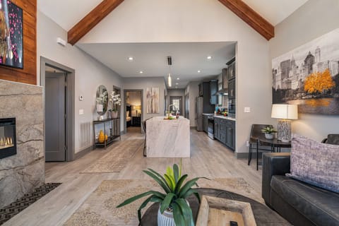 Bright and inviting living room with cozy seating, vaulted ceilings, and stylish décor—perfect for relaxing after a day of exploring!