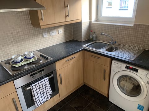 Fully equipped kitchen plenty of cupboard space integrated refuse bin