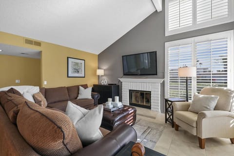 Living Room with Fireplace and Louvered Shutters