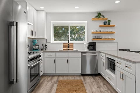 A bright, sleek kitchen where style meets functionality in every corner, featuring modern finishes and thoughtful design to make meal prep a breeze.