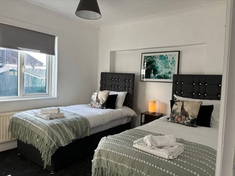 Unwind in our cozy and comfortable bedroom, perfect for a restful night's sleep. Book your stay now! (1)