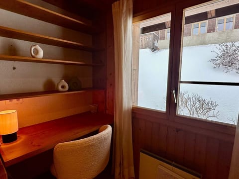 bedroom with office table and garden views