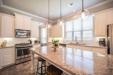 Beautiful Kitchen with Spacious Counter Top and Stainless Steel Appliances