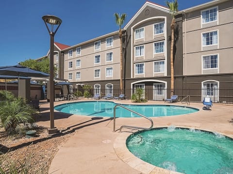 Slip into the bubbling hot tub beside the sunny pool.