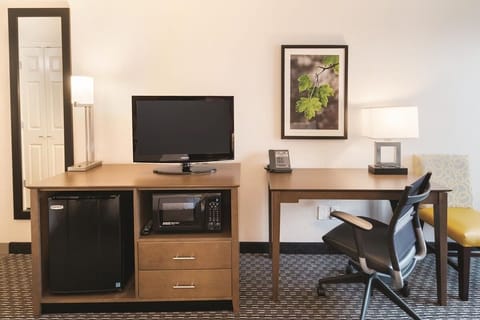 Settle in with a roomy desk, TV, and snacks nearby.