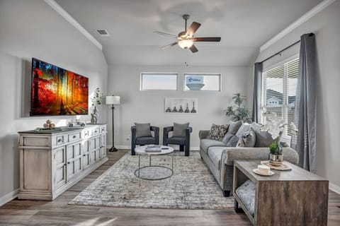 Relax in a serene living room where Parisian style meets everyday comfort.