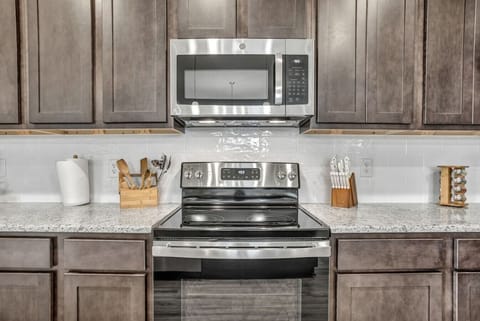 Modern appliances thoughtfully integrated into a refined kitchen design.
