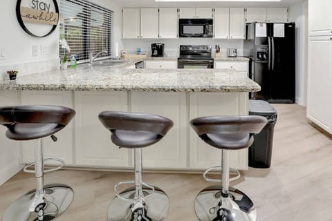 The kitchen offers ample storage and prep space.