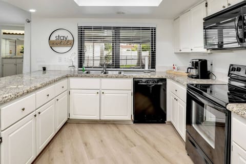 The kitchen is fully equipped and ready for any cooking or cocktailing endeavor.