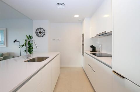 Another picture of the modern open kitchen in this property
