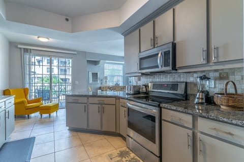 Fully stocked kitchen with Granite countertops and stainless steel appliances
