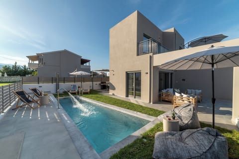 KS Si Villa - Outdoor space with swimming pool, seating area and BBQ facilities