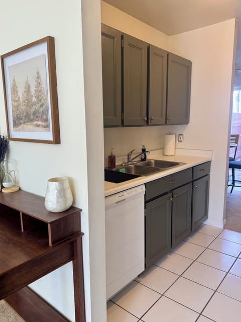 Fully equipped kitchen with pots, pans, utensils, coffee maker and more.