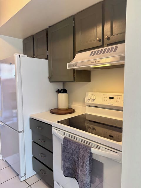 Fully equipped kitchen with pots, pans, utensils, coffee maker and more.