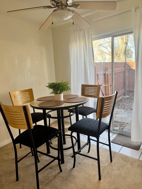 Dining area attached to kitchen seats four.