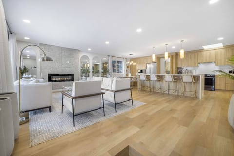Relax in the spacious living room with cozy seating and plenty of natural light.
