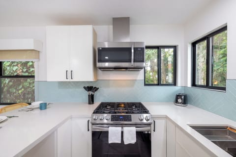kitchen with stove, oven, and microwave