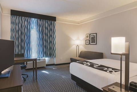 Unwind after exploring with a cozy bed and workspace.