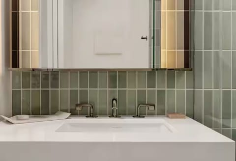 Ease into your routine with generous counter space and mirrors.