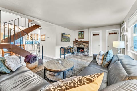 Living room: Smart TV w/ cable, wood-burning fireplace (no wood provided), central heat, no A/C