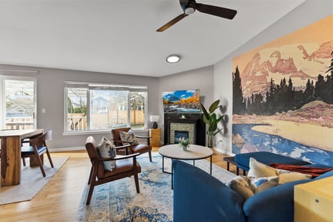 The peaceful living room features a mural of Mt Rainier by Hiroshi Yoshida