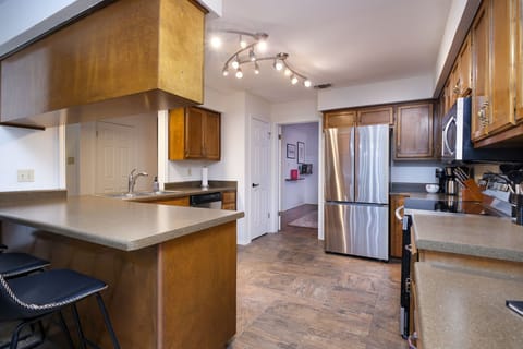 Featuring high-end appliances and plenty of cabinet space.