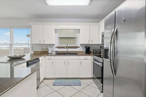 The heart of the home—modern appliances, sleek fridge, and plenty of space! 