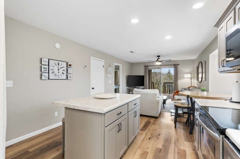 The bright, open kitchen offers ample space & every home comfort