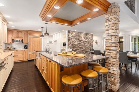 The kitchen island has snack bar seating for 6 people