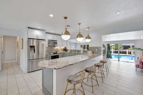 The airy, open kitchen offers ample space & all the comforts of home