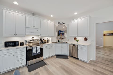 The fully stocked kitchen is perfect for cooking meals.