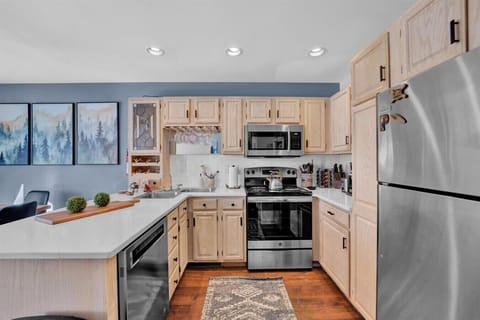 Cook up a storm in this fully equipped kitchen with sleek stainless appliances and a spacious fridge for all your ingredients!