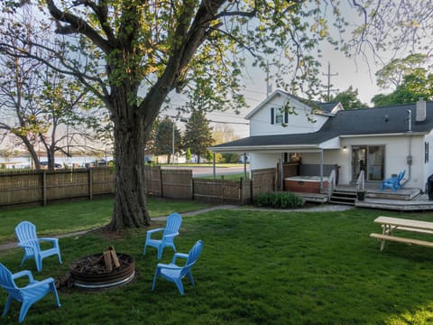 Large fenced backyard with firepit and seating — great for families