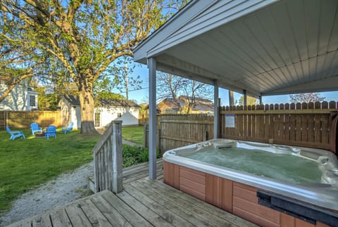 Private hot tub under covered patio — perfect year-round relaxation
