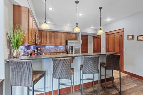 Fully Stocked Kitchen with seating for 4 at the bar