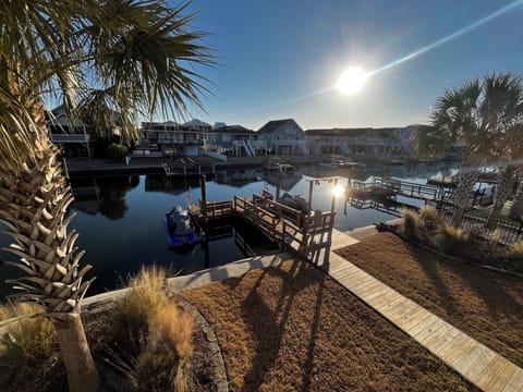 Backyard and canal. Large boat dock with seating