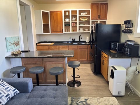 View from living area of bar for meals and kitchen