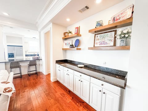 Living room counter space allows for food/beverage outside of the kitchen area