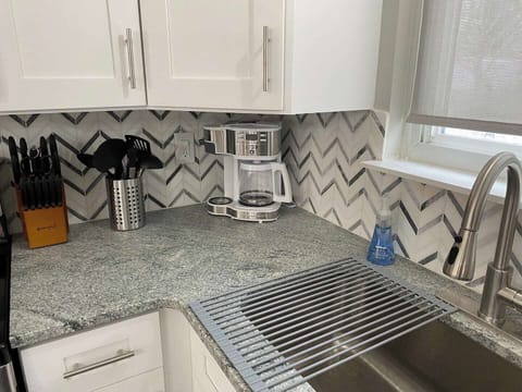 All the utensils you need to prep and cook your favorite meals, in addition to a coffee maker that allows you to brew one cup at a time or a whole pot!