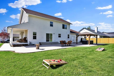 Enoy the backyard with dining table, corn hole and private hot tub!