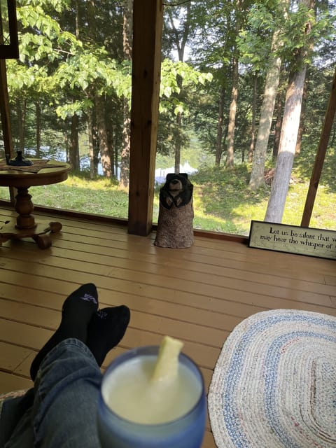 Screened in Porch 12 ft x 24 ft another dining table, rocking chairs and benches