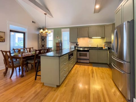 Open concept kitchen, dining and living space