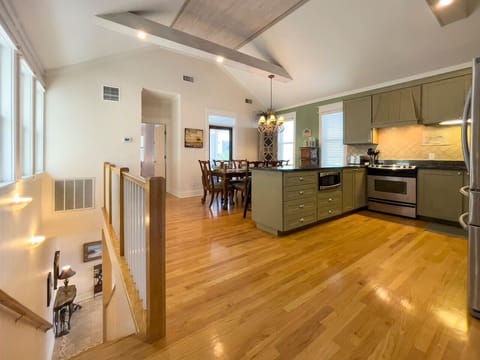 Kitchen, dining and living spaces along with a king bedroom and full bathroom and covered dining porch are on the 2nd floor of the home