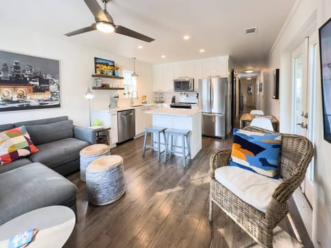 The front door opens onto the living, kitchen and dining space.