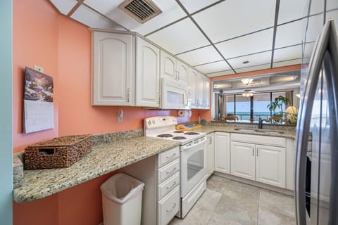 Modern kitchen with all the essentials and a view of the ocean.