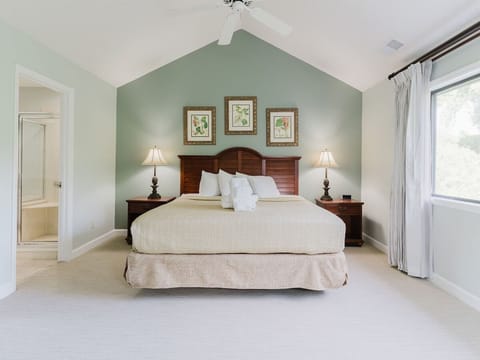 Recharge in a spacious king suite with calming coastal tones.